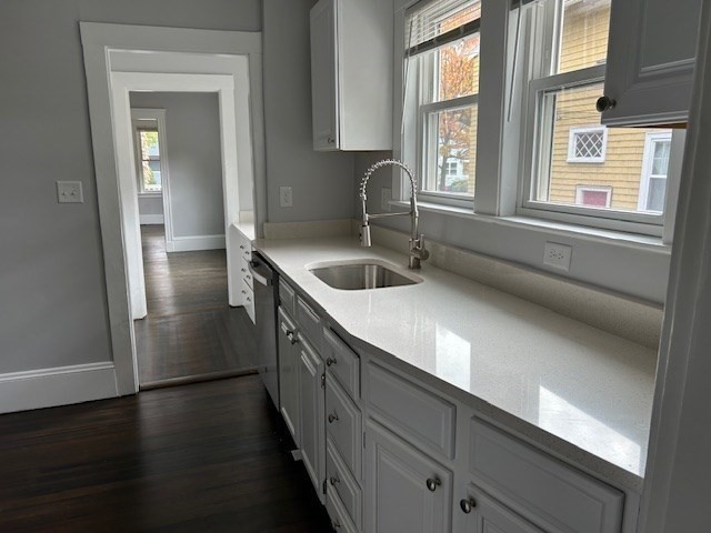 84 Aberdeen Avenue, Unit 1 Cambridge, MA 02138 - Photo 7 of 17 a kitchen with a refrigerator a sink and dishwasher with wooden floor