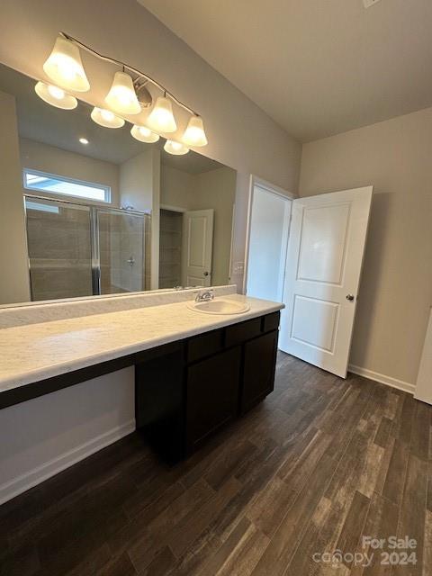 6128 Busch Way Midland, NC 28107 - Photo 16 of 26 a bathroom with a double vanity sink and a mirror