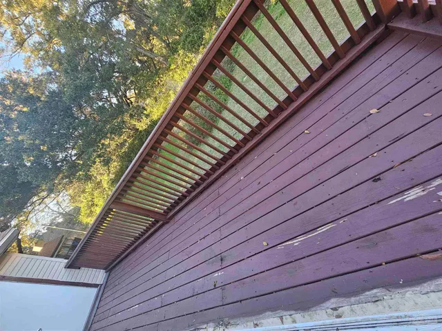 a wooden deck with sky view