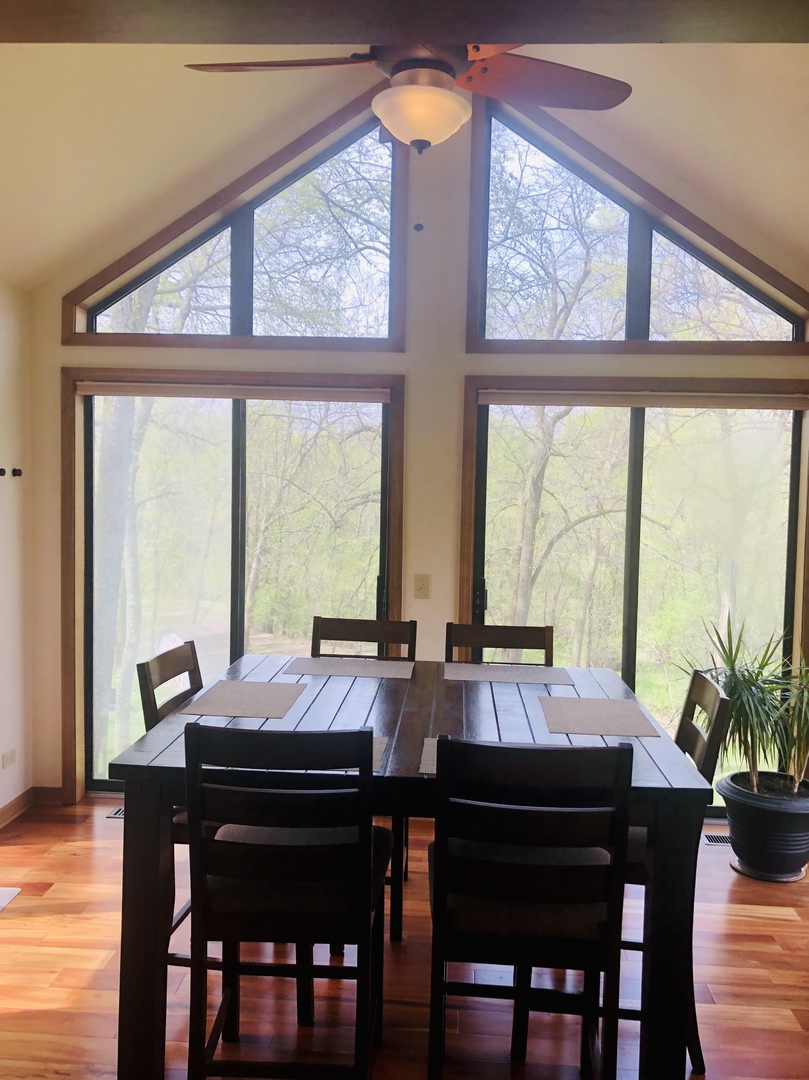 34 River Bend Road Montgomery, IL 60538 - Photo 11 of 33 a view of a dining room with furniture window and wooden floor