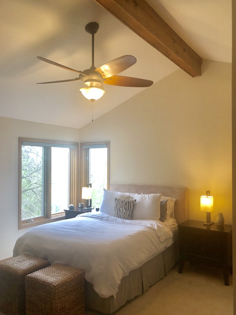 34 River Bend Road Montgomery, IL 60538 - Photo 22 of 33 a bedroom with a bed and a chandelier