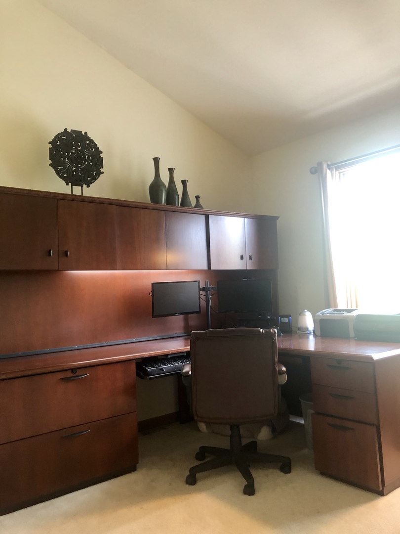 34 River Bend Road Montgomery, IL 60538 - Photo 25 of 33 a workspace with furniture and lamp