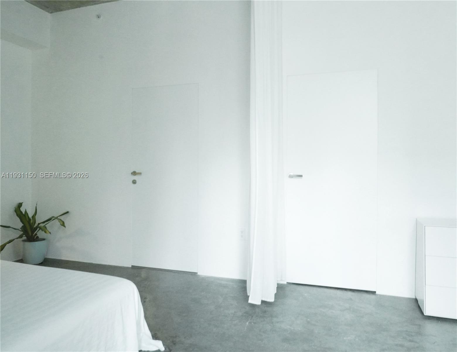 133 Northeast 2nd Avenue, Unit 1608 Miami, FL 33132 - Photo 15 of 55 Curtains as flexibe partitions in the open floor plan.