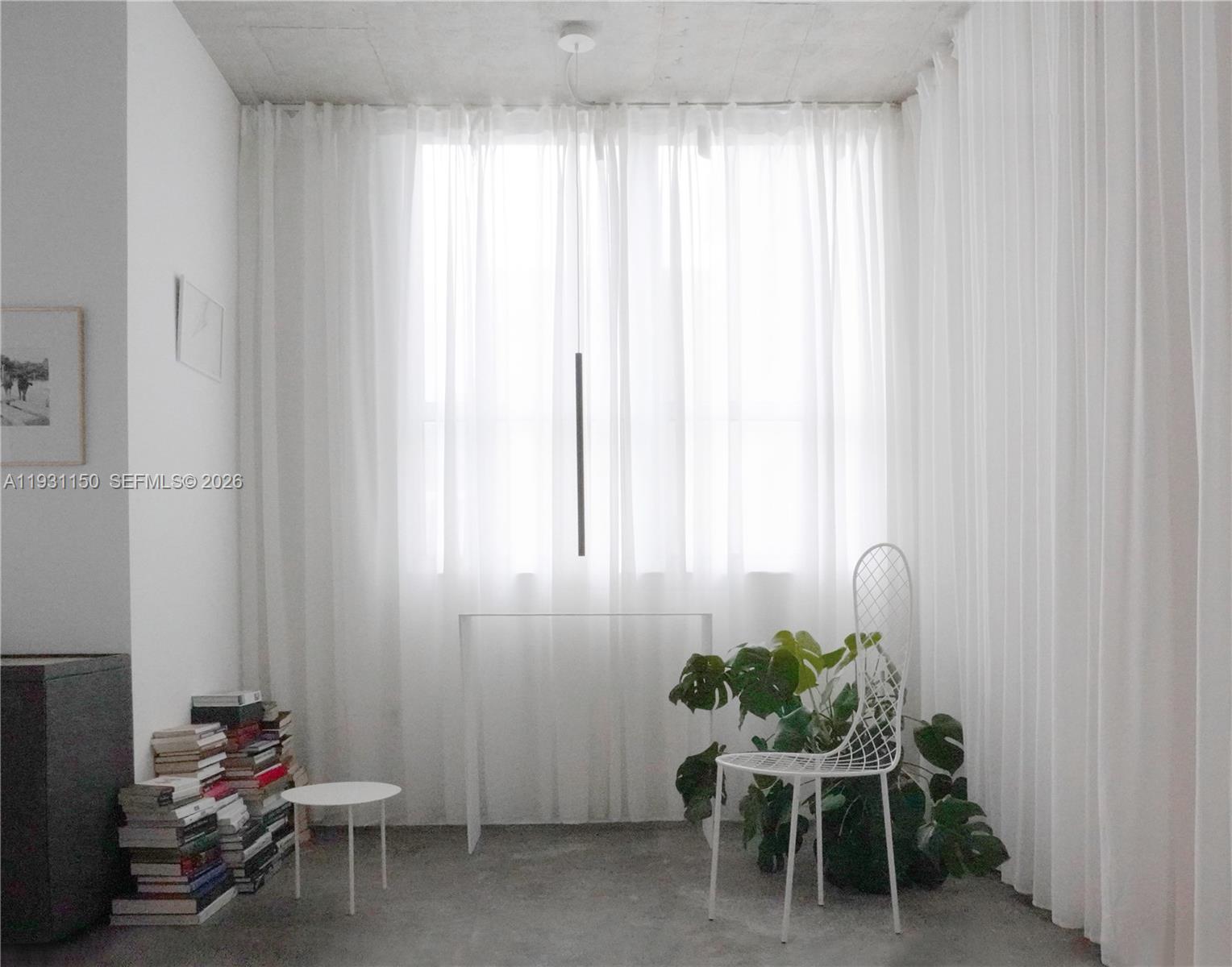 133 Northeast 2nd Avenue, Unit 1608 Miami, FL 33132 - Photo 10 of 55 Reading area with pendant lighting.