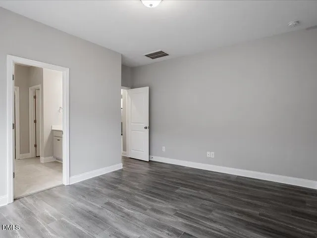 a bathroom with a sink double vanity and a mirror