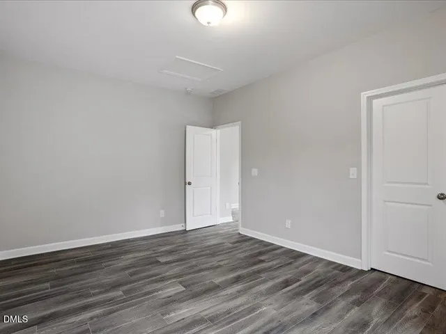 a view of a balcony with wooden floor