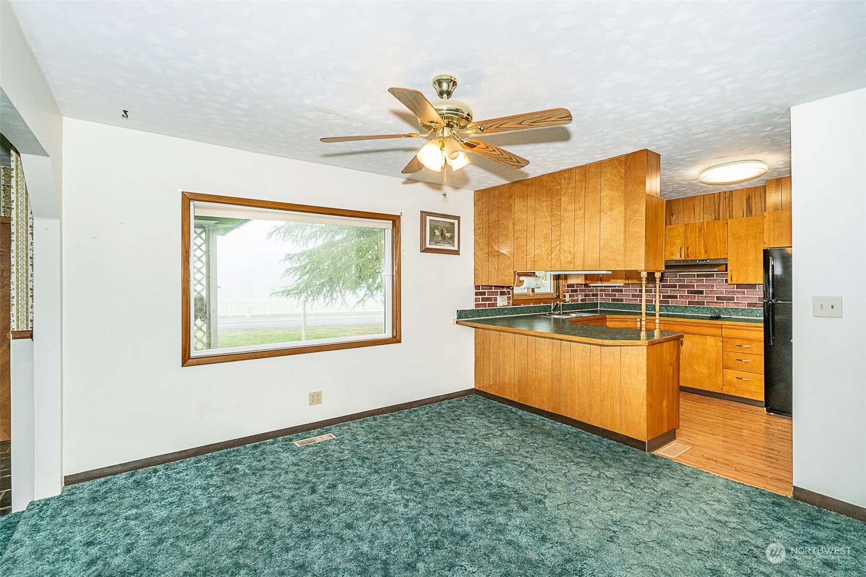 728 Rhoades Road Winlock, WA 98596 - Photo 15 of 40 a view of a kitchen with a sink and a window