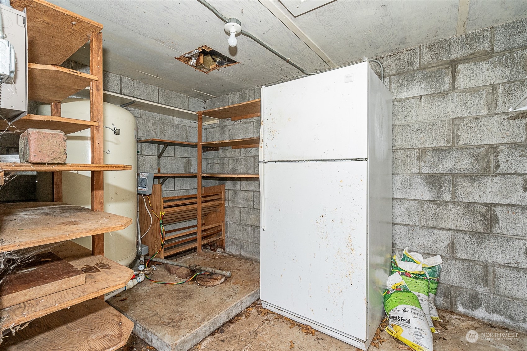 728 Rhoades Road Winlock, WA 98596 - Photo 35 of 40 a view of storage and utility room with racks on the wall