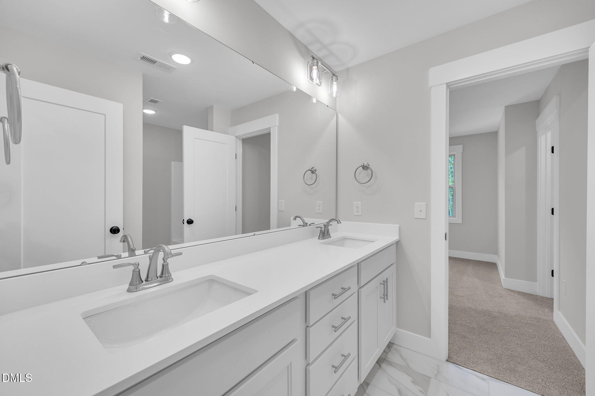 378 Freedom Ridge Drive Smithfield, NC 27577 - Photo 24 of 33 a bathroom with double vanity sinks and a mirror