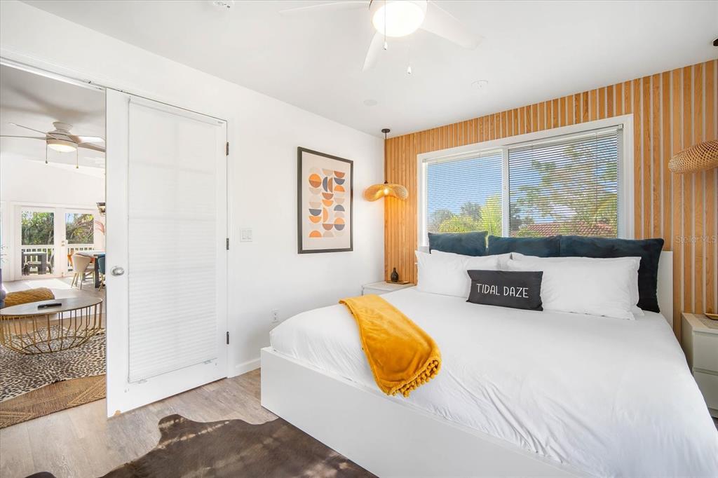 203 72nd Street Holmes Beach, FL 34217 - Photo 20 of 75 a bedroom with a bed and a couch