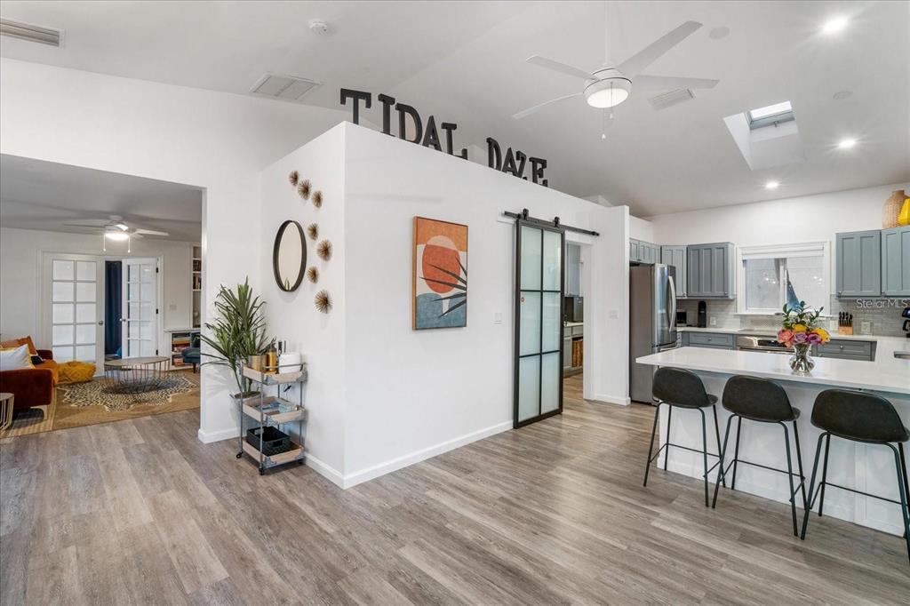 203 72nd Street Holmes Beach, FL 34217 - Photo 37 of 75 a living room with furniture and wooden floor