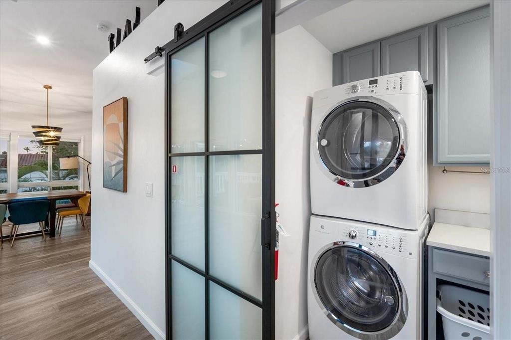 203 72nd Street Holmes Beach, FL 34217 - Photo 38 of 75 a view of a hallway with washer and dryer