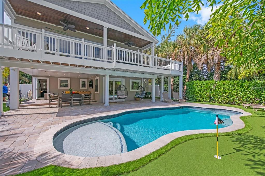 203 72nd Street Holmes Beach, FL 34217 - Photo 55 of 75 a view of a house with swimming pool and sitting area