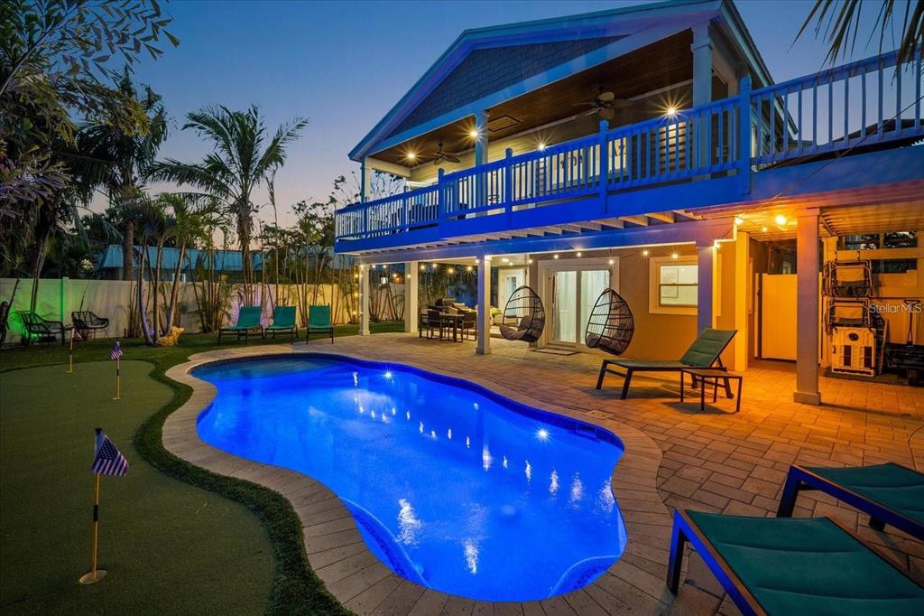 203 72nd Street Holmes Beach, FL 34217 - Photo 64 of 75 a view of swimming pool with outdoor seating