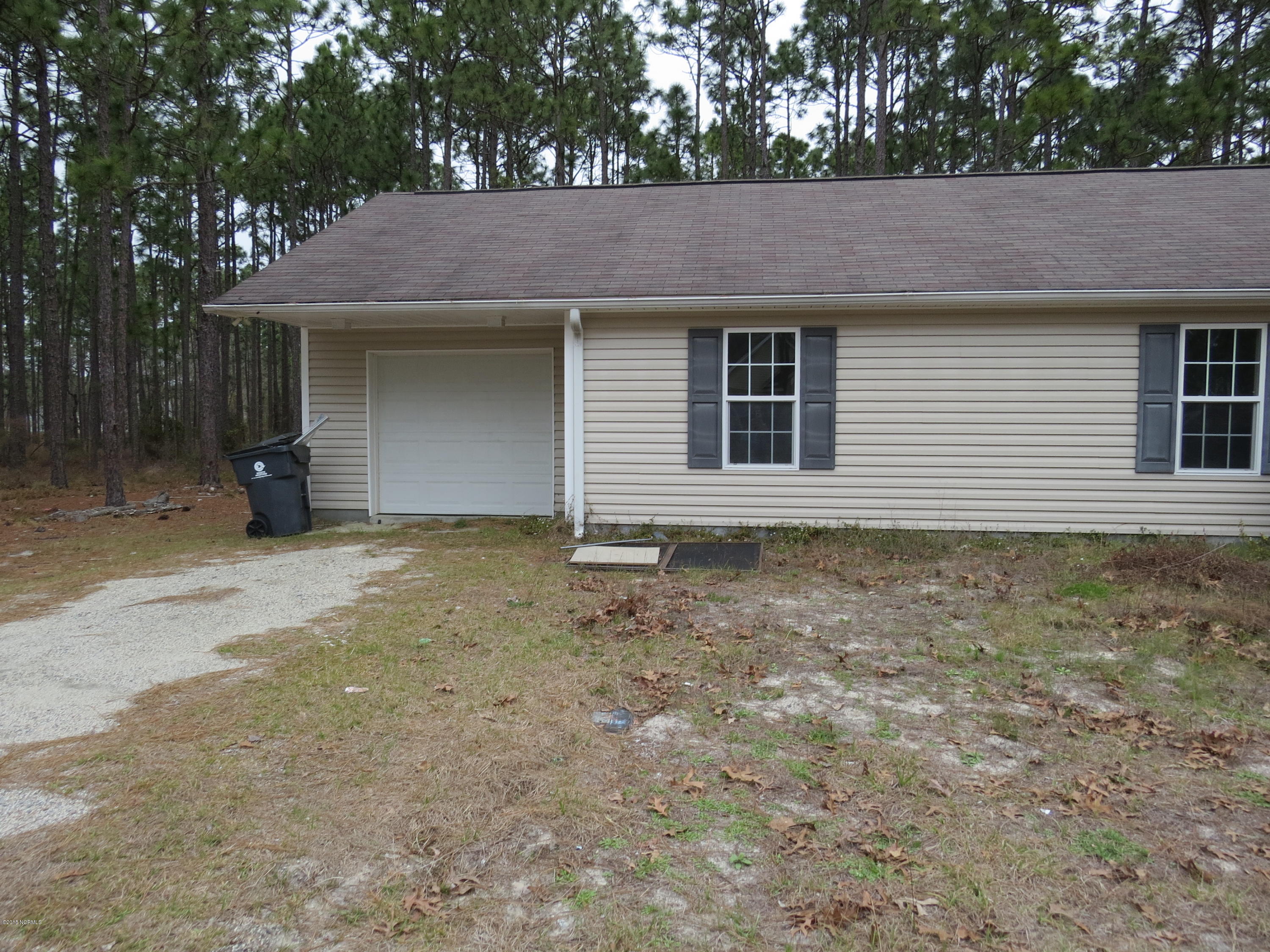 2251 East Boiling Spring Road, Unit E Southport, NC 28461 - Photo 3 of 16 Side Garage