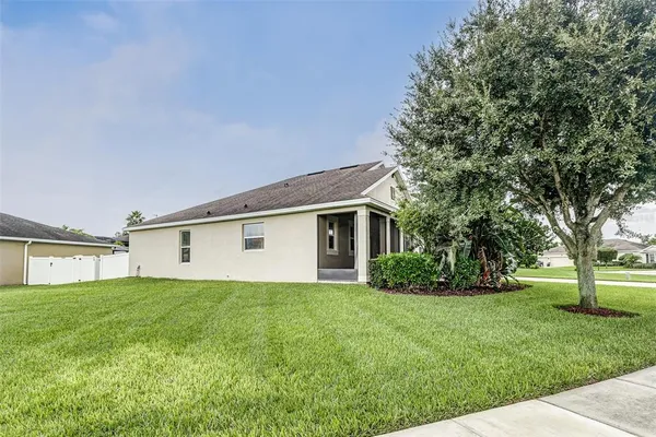 a front view of house with yard and green space