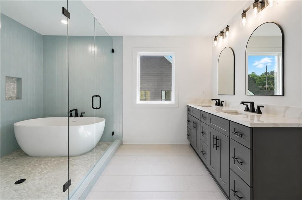 125 Old Alabama Road Southeast Emerson, GA 30137 - Photo 24 of 37 a spacious bathroom with a double vanity sink mirror and bathtub