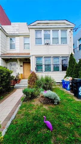 a front view of house with yard and outdoor seating