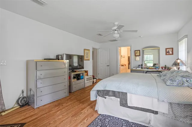 a view of walk in closet with clothes