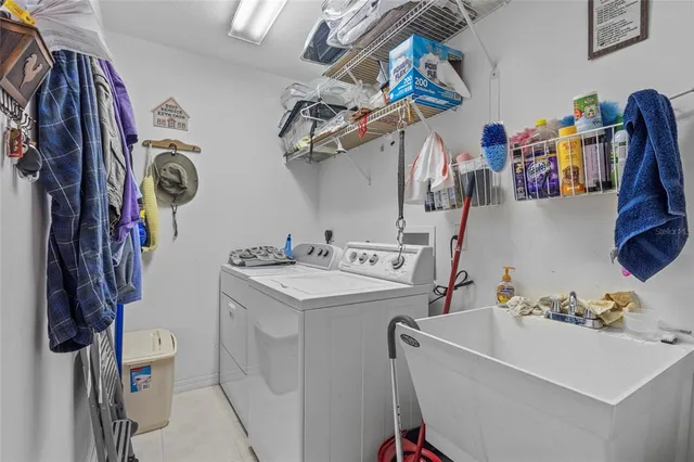 a kitchen with stainless steel appliances kitchen island granite countertop a refrigerator and microwave