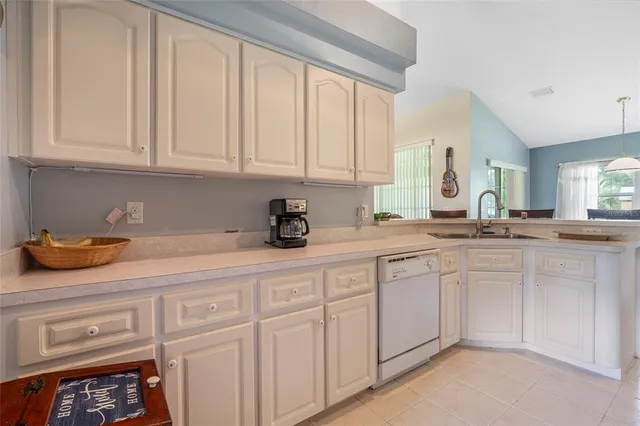 a kitchen with stainless steel appliances granite countertop a stove microwave and refrigerator