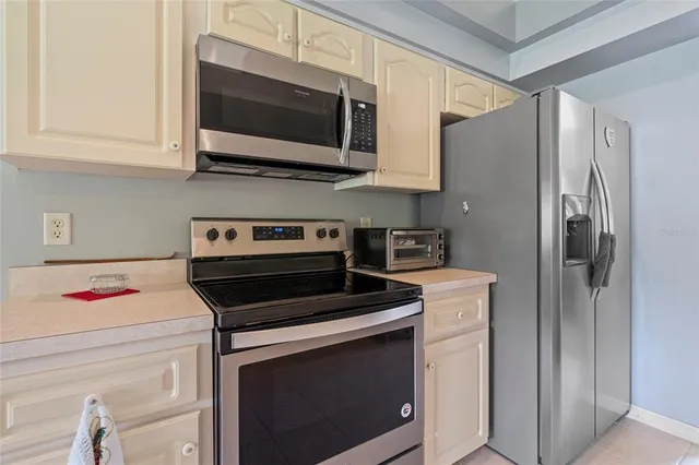 a living room with furniture a table and a large window