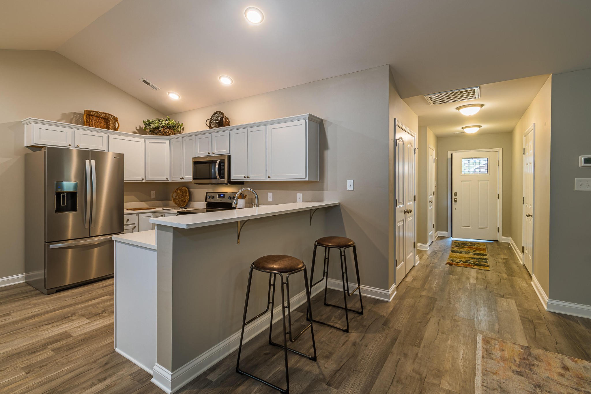 700 Spring Park Road Knoxville, TN 37914 - Photo 20 of 25 a kitchen with kitchen island a refrigerator a counter top space and cabinets