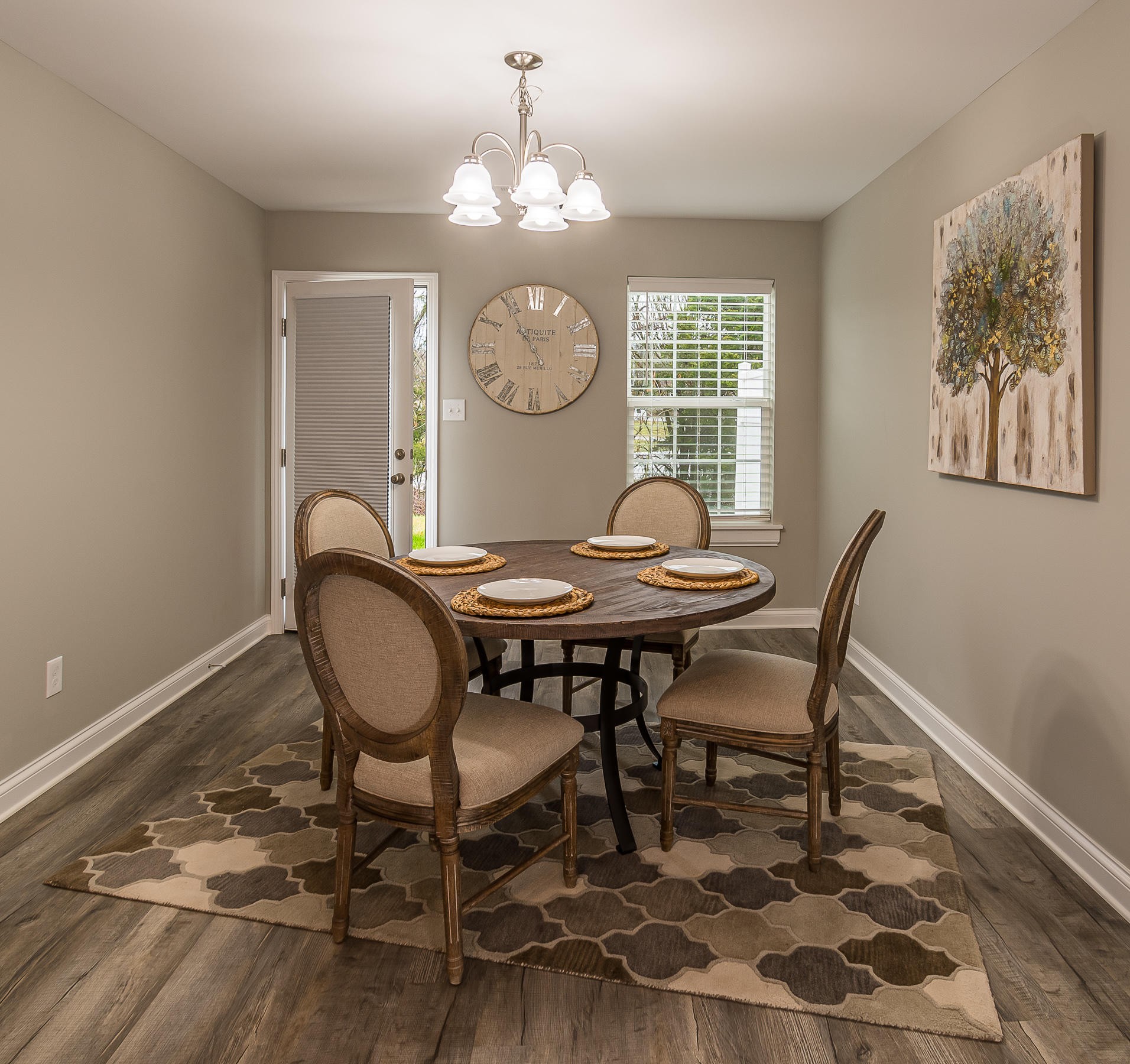 700 Spring Park Road Knoxville, TN 37914 - Photo 23 of 25 a view of a dining room with furniture and a chandelier