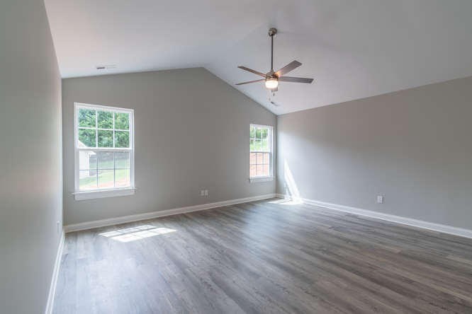 700 Spring Park Road Knoxville, TN 37914 - Photo 9 of 25 a view of an empty room with wooden floor and a window