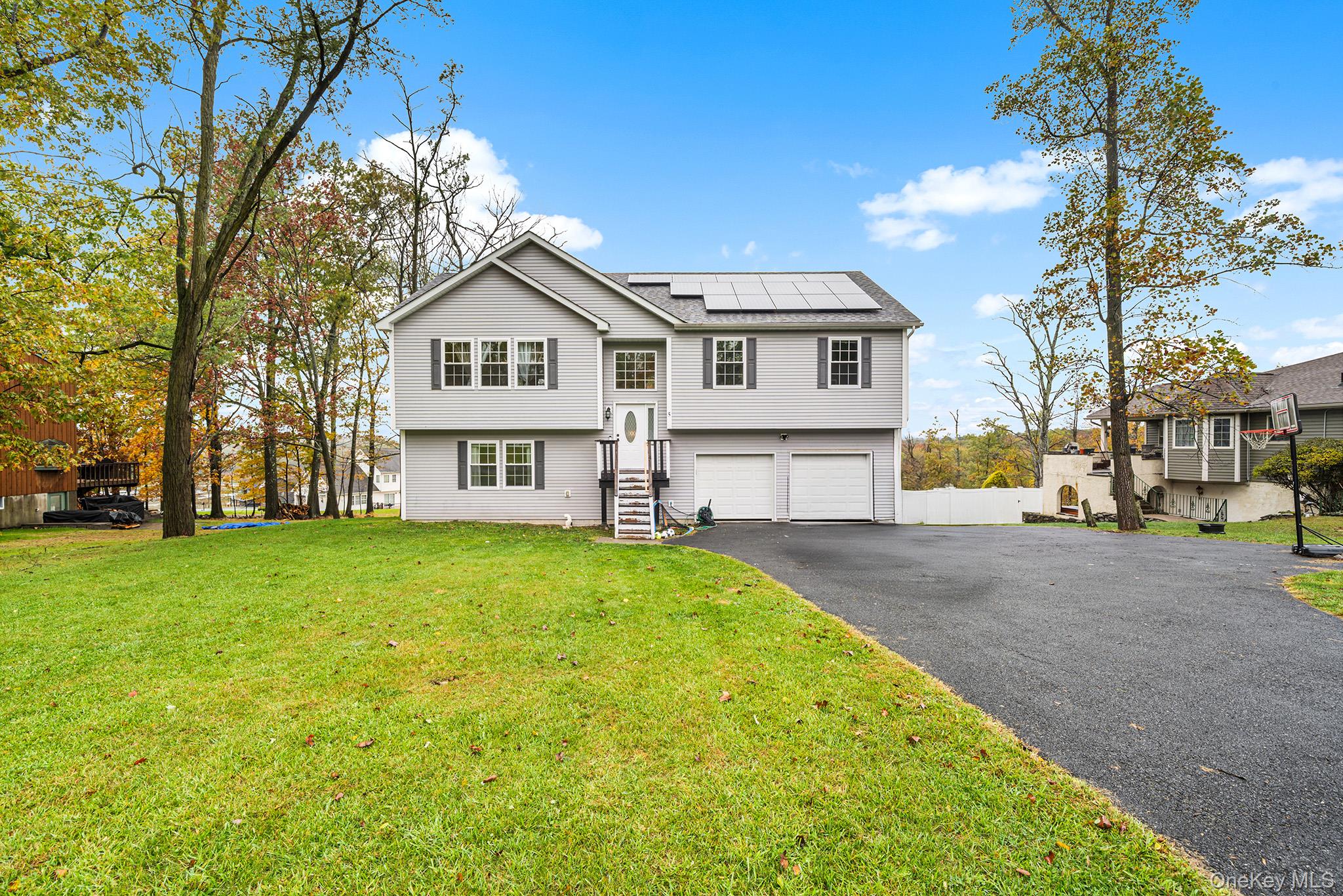 5 Oak Ridge Road Middletown, NY 10940 - Photo 1 of 24 a view of a big house with a big yard and large trees