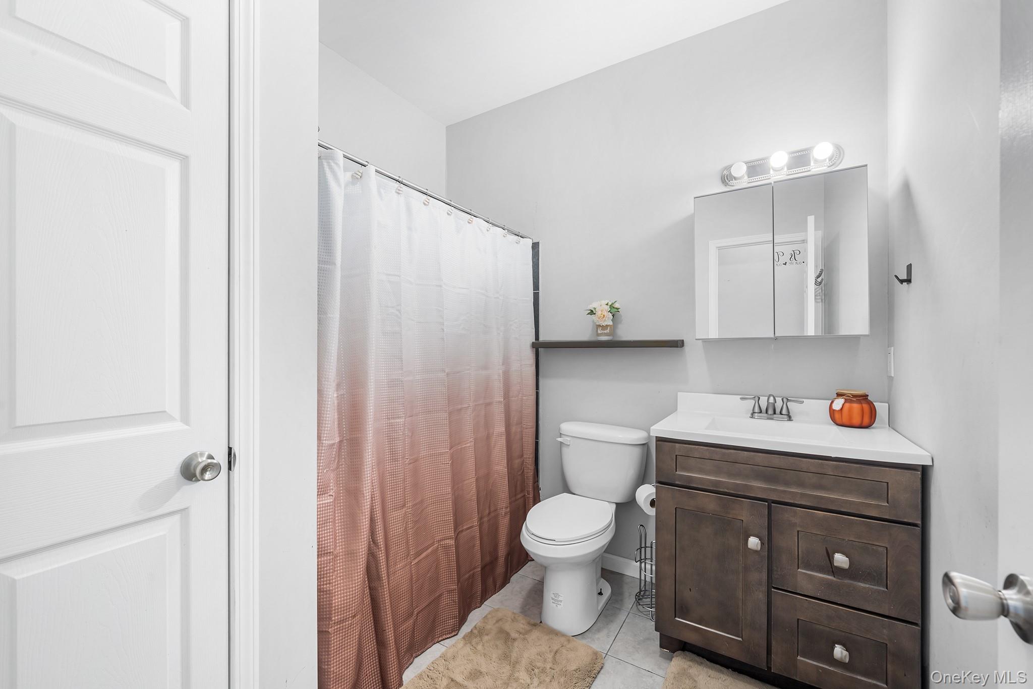 5 Oak Ridge Road Middletown, NY 10940 - Photo 12 of 24 a white toilet sitting next to a bathroom sink