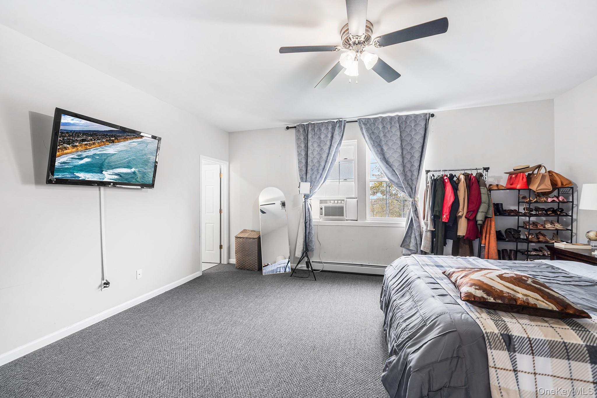 5 Oak Ridge Road Middletown, NY 10940 - Photo 15 of 24 a bed room with a bed and a walk in closet