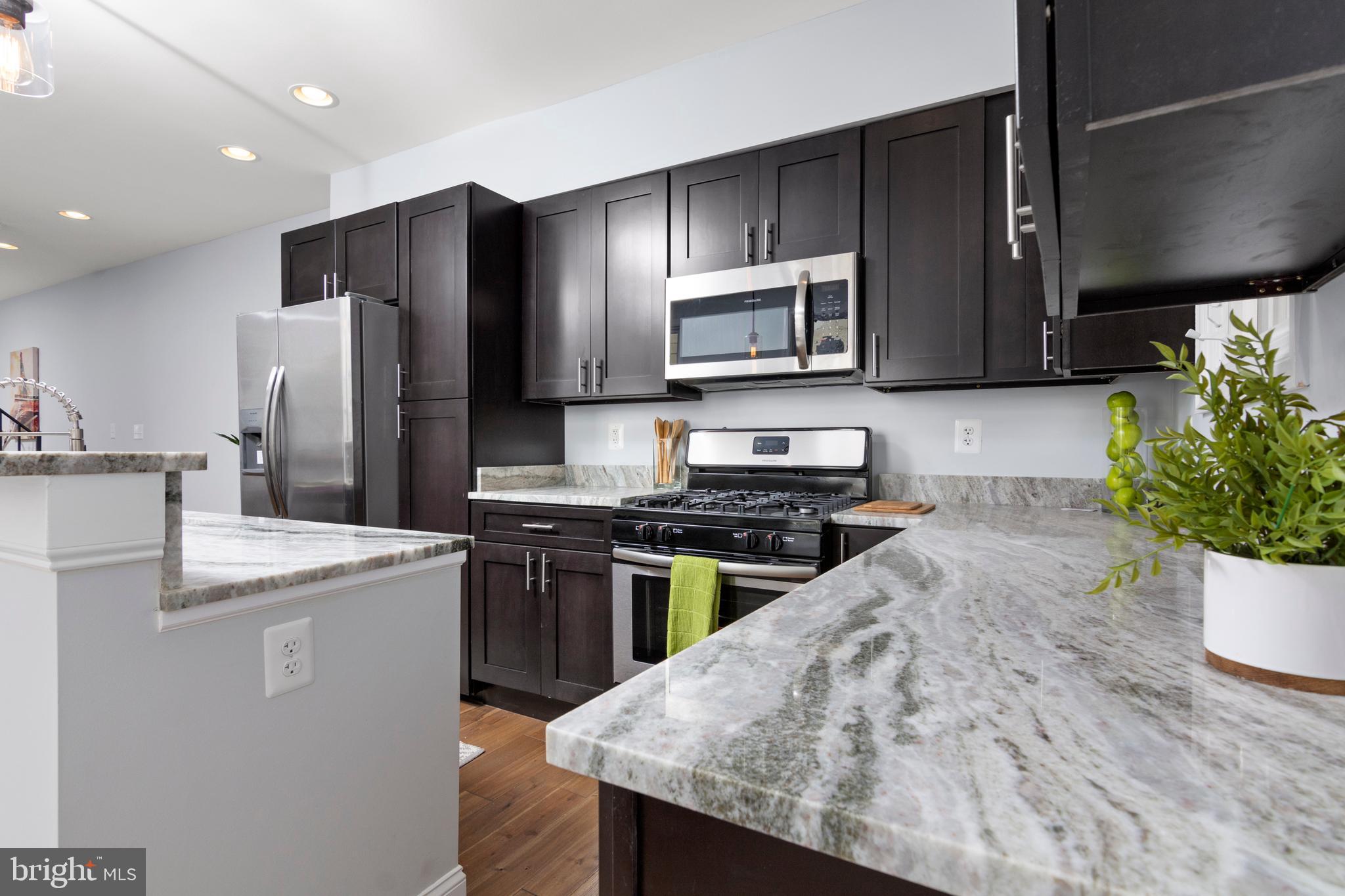 3738 Falls Road Baltimore, MD 21211 - Photo 8 of 39 Kitchen with island, matches Frigidaire appliances
