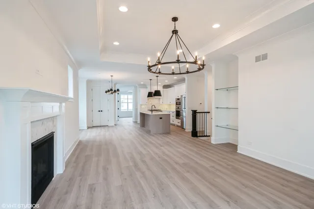 a view of a kitchen with a sink and dishwasher wooden floor kitchen view