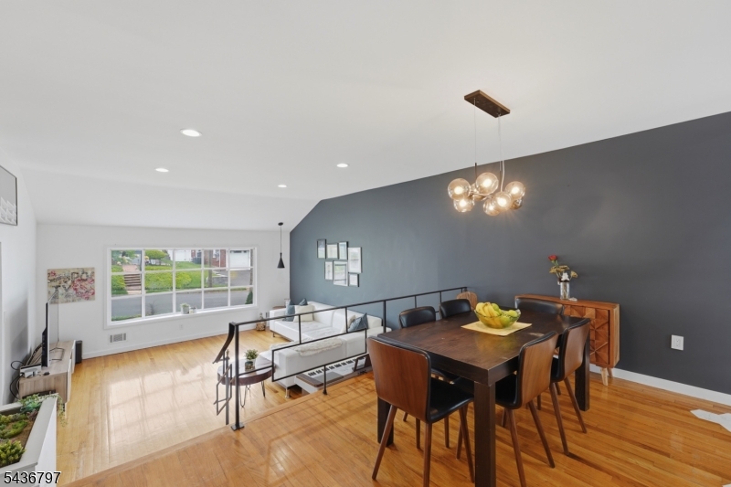 17 Arthur Drive Rutherford, NJ 07070 - Photo 9 of 45 a view of a dining room with furniture and wooden floor
