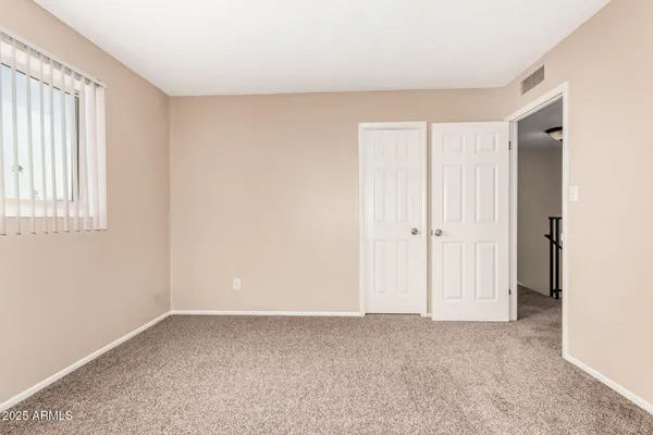 a view of an empty room and window