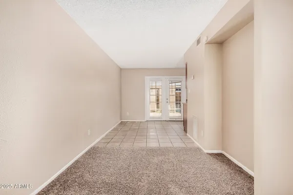 a view of an empty room and window
