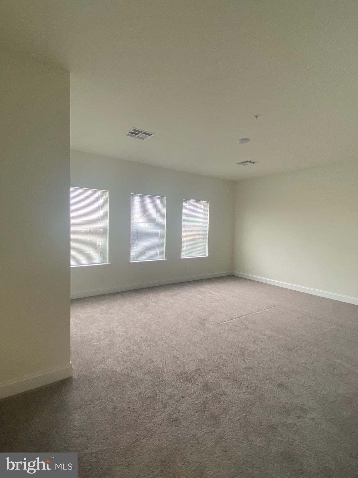 1812 Main Street, Unit 203 Chester, MD 21619 - Photo 13 of 24 a view of an empty room with a window