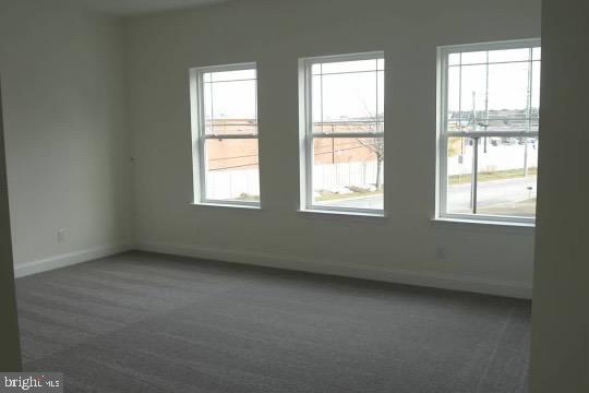 1812 Main Street, Unit 203 Chester, MD 21619 - Photo 14 of 24 an empty room with a window
