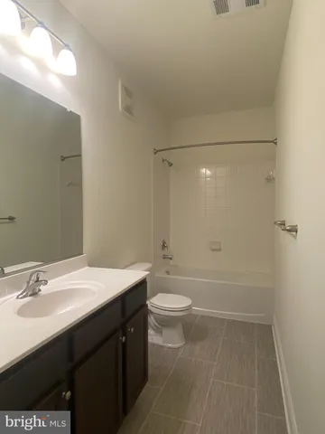 a view of an empty room with windows