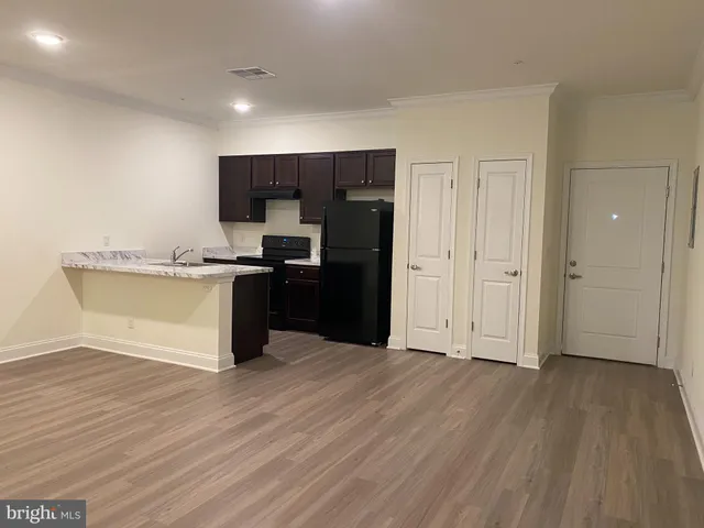 a view of kitchen with wooden floor