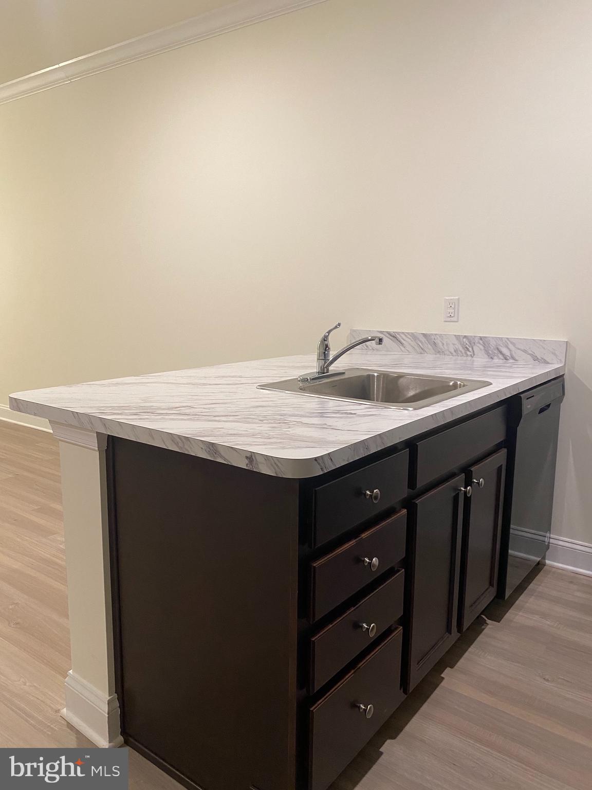 1812 Main Street, Unit 203 Chester, MD 21619 - Photo 6 of 24 a bathroom with a granite countertop sink and a mirror