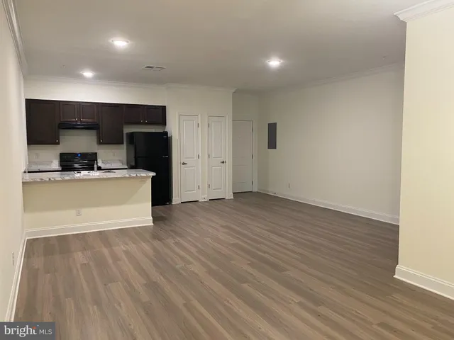 a view of a kitchen with a sink and tap
