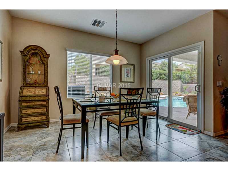 2264 Saxtons River Road Henderson, NV 89044 - Photo 11 of 25 Dining Room. Eat in Kitchen, Entry to Covered Patio, Pool and Spa