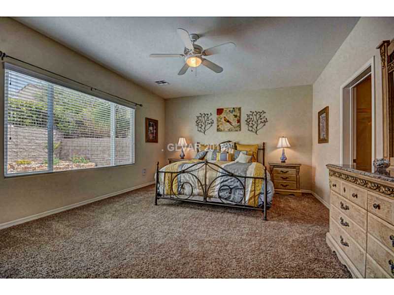 2264 Saxtons River Road Henderson, NV 89044 - Photo 13 of 25 Master Bedroom. Master with Access to Patio pool and Spa.