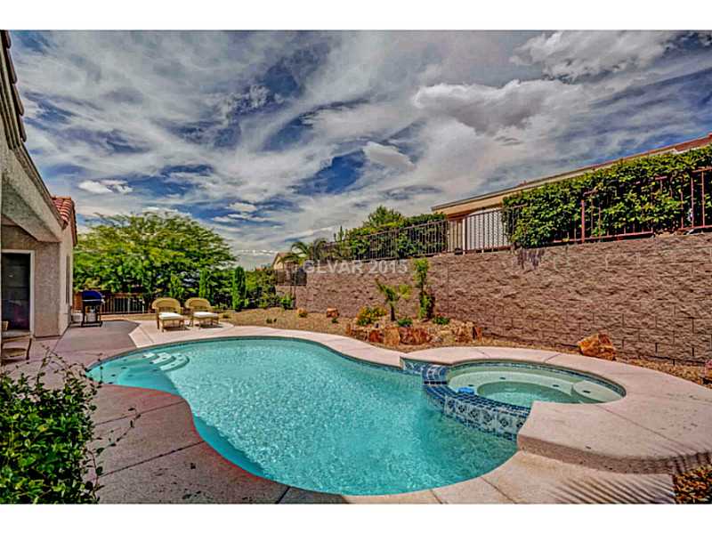 2264 Saxtons River Road Henderson, NV 89044 - Photo 23 of 25 Swimming Pool/Hot Tub/Sauna. Large Yard with Pool, Spa and Garden area. Low Maintenance Desert Landscaping