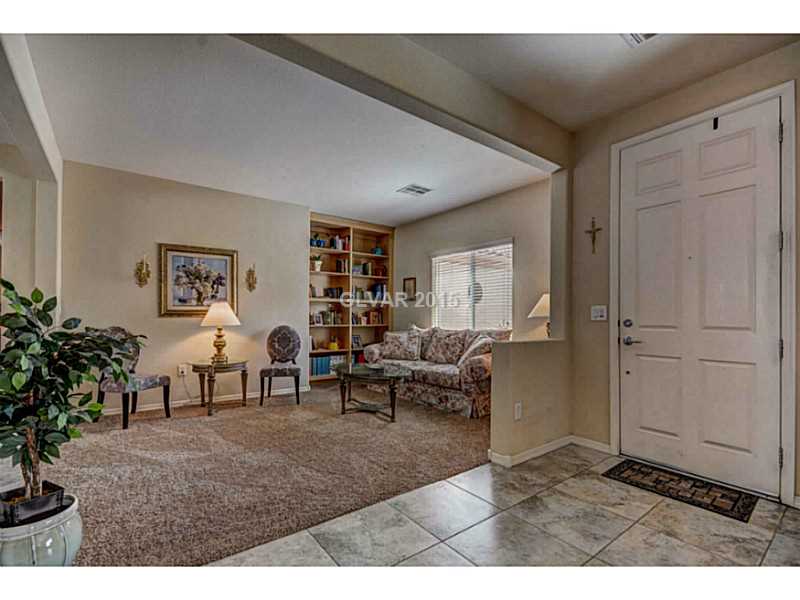 2264 Saxtons River Road Henderson, NV 89044 - Photo 4 of 25 Living Room. Formal Living with Built-in Bookshelves