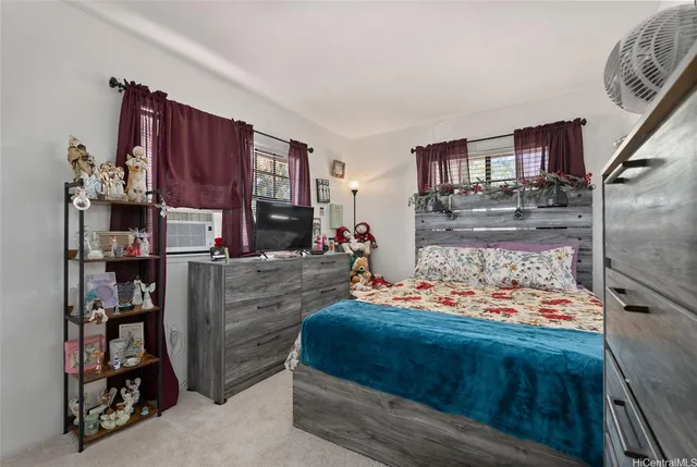 a bed room with a bed and a book shelf