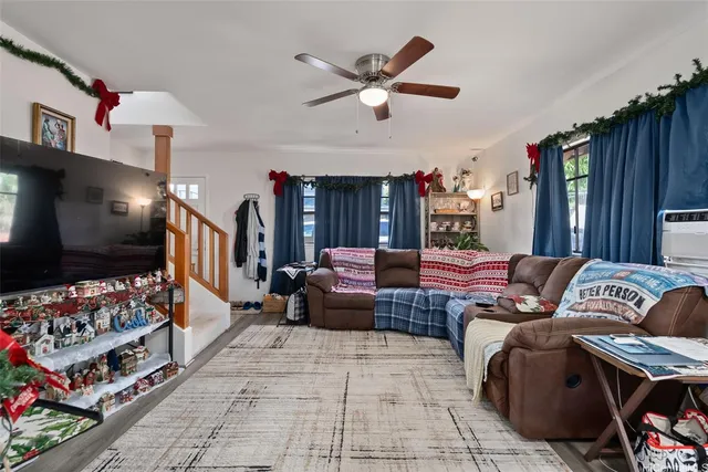 a living room with furniture and a flat screen tv