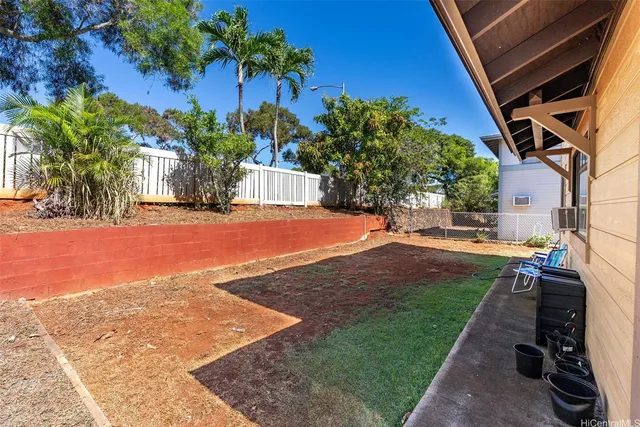 a view of a backyard of the house